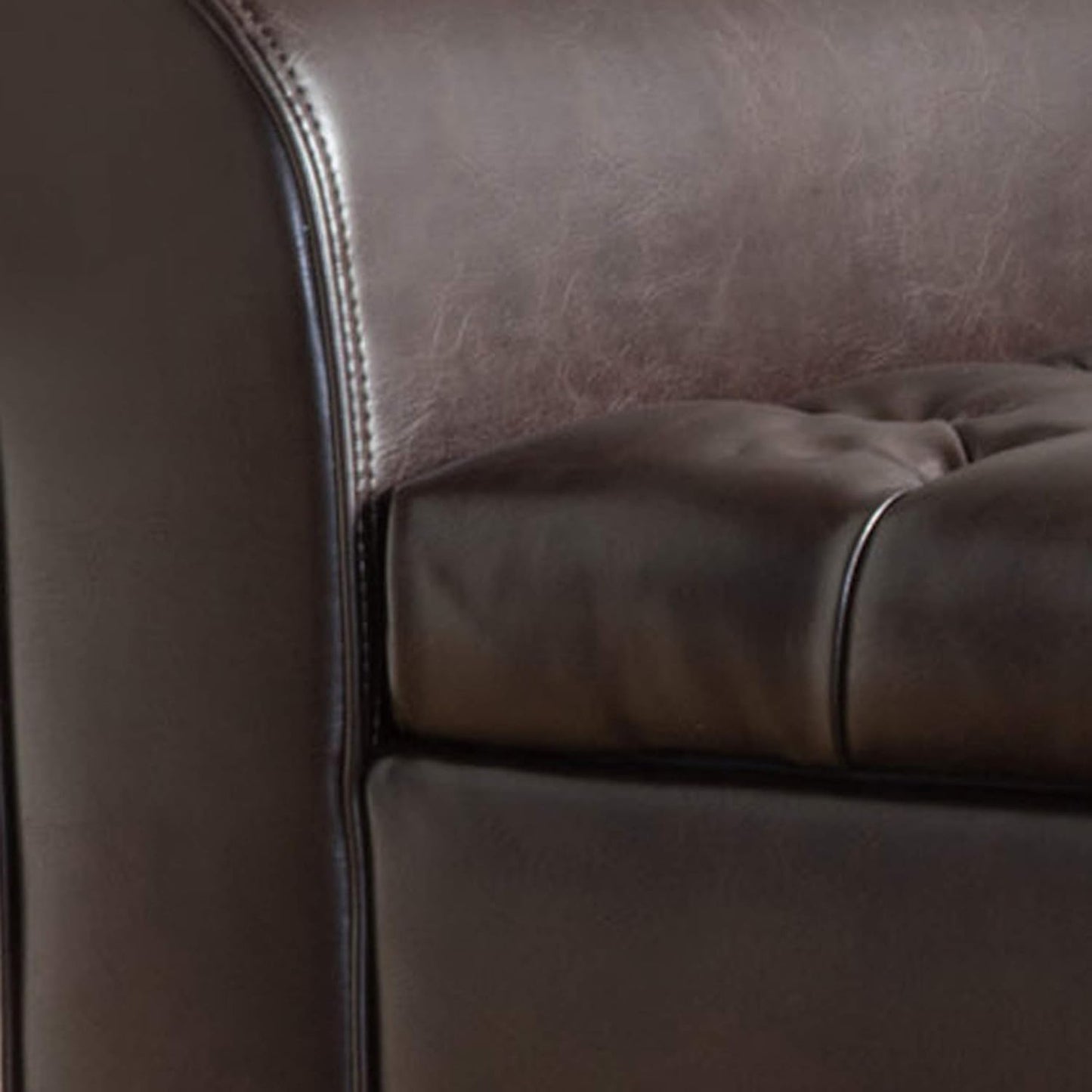 Stylish brown storage ottoman with button-tufted diamond stitch, rolled arms, and spacious interior for pillows and blankets. Crafted from durable PU leather and birch wood, perfect for seating and storage in modern living spaces.