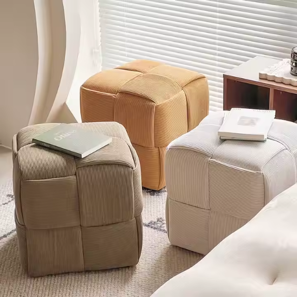 Light chocolate brown corduroy ottoman with cross-stitch design and sturdy wood frame