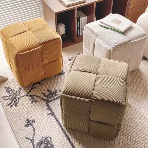 Light chocolate brown corduroy ottoman with cross-stitch design and sturdy wood frame