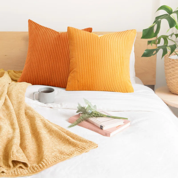 Set of 4 striped corduroy pillow covers in green, red, orange, and yellow – 18x18 decorative cushion covers with gradient pattern and hidden zippers for boho or festive home decor.