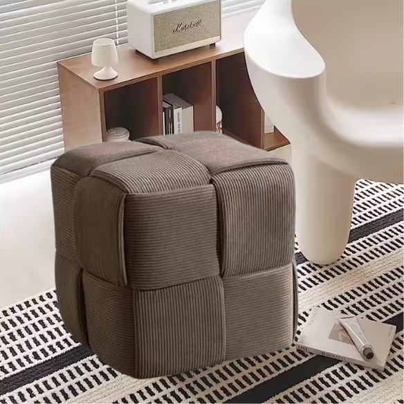 Light chocolate brown corduroy ottoman with cross-stitch design and sturdy wood frame