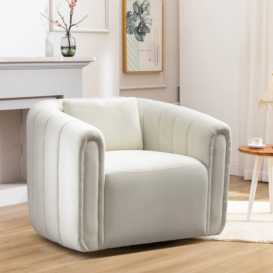 Beige barrel swivel chair upholstered in soft velvet fabric, featuring a 360-degree rotating base, a lumbar pillow for support, and high-density foam cushioning. The elegant chair has a neutral beige color, sleek barrel design, and sturdy metal swivel base with a solid wood frame. Perfect for adding comfort and sophistication to living rooms, nurseries, or bedrooms.