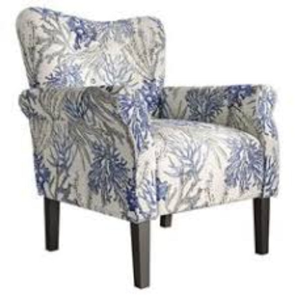 A stylish Blue Coral Accent Chair featuring a vibrant blue coral fabric with a unique pattern. The chair has a tufted wingback design, gracefully tapered wood legs, and padded armrests for optimal comfort. It combines modern sophistication with a classic aesthetic, ideal for any living room, office, or reading nook.