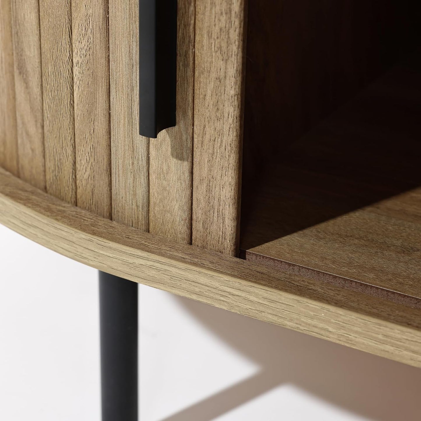 Mid-century modern coffee table with tambour sliding doors, featuring a warm oak grain finish and sleek, compact design. Ideal for storage and stylish living room decor.