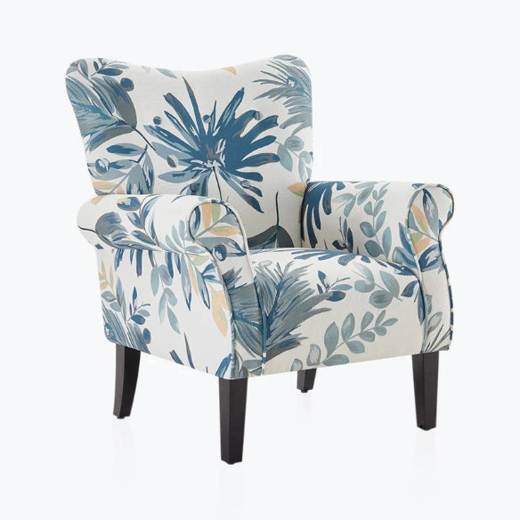 Blue and cream floral accent chair with a high backrest and tapered wooden legs. The chair features a soft floral pattern in serene blue and cream tones, offering a blend of modern sophistication and vintage charm. The design includes cushioned armrests and a generously padded seat for comfort. Ideal for a living room, office, or reading nook, this elegant chair adds a stylish and inviting touch to any space.