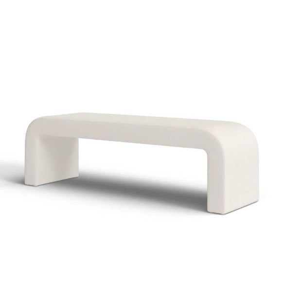 Luxurious cream bouclé ottoman with plush foam cushioning, versatile storage, and sleek sled legs, perfect for enhancing bedroom decor or any room. Premium construction, easy care, and a 500 lb weight capacity for ultimate comfort and style.