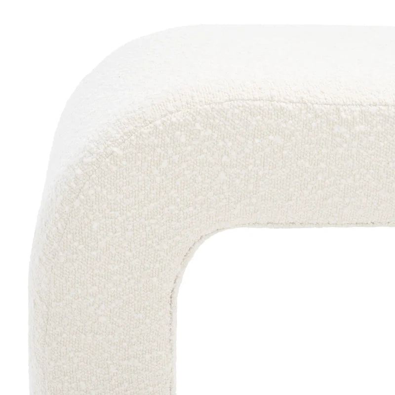 Luxurious cream bouclé ottoman with plush foam cushioning, versatile storage, and sleek sled legs, perfect for enhancing bedroom decor or any room. Premium construction, easy care, and a 500 lb weight capacity for ultimate comfort and style.