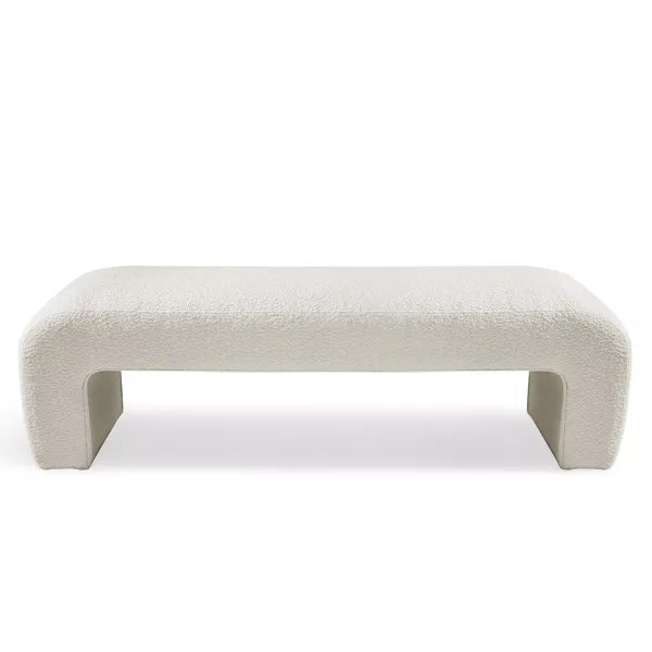 Luxurious cream bouclé ottoman with plush foam cushioning, versatile storage, and sleek sled legs, perfect for enhancing bedroom decor or any room. Premium construction, easy care, and a 500 lb weight capacity for ultimate comfort and style.