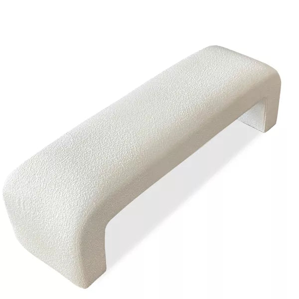 Luxurious cream bouclé ottoman with plush foam cushioning, versatile storage, and sleek sled legs, perfect for enhancing bedroom decor or any room. Premium construction, easy care, and a 500 lb weight capacity for ultimate comfort and style.