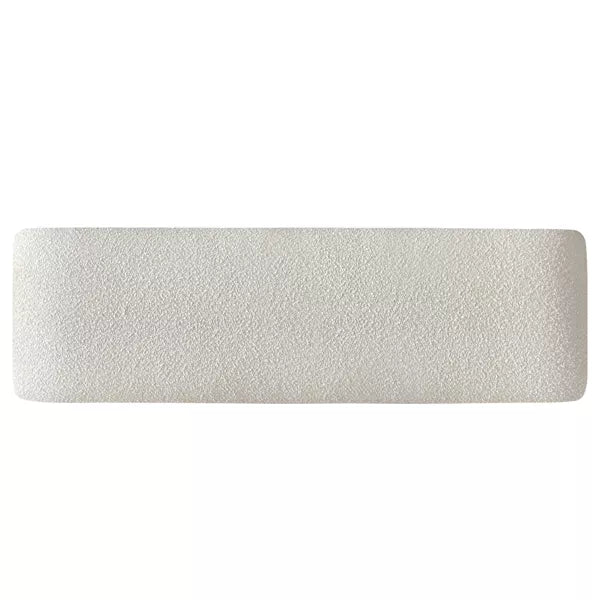 Luxurious cream bouclé ottoman with plush foam cushioning, versatile storage, and sleek sled legs, perfect for enhancing bedroom decor or any room. Premium construction, easy care, and a 500 lb weight capacity for ultimate comfort and style.