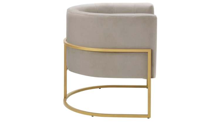 Taupe velvet barrel accent chair with gold accents and a hidden, storable ottoman. Features flared arms, foam-filled seat and back for comfort, a solid wood frame with a sled base for stability, and includes toss pillows for added comfort. The ottoman conveniently tucks under the chair to save space, creating a stylish, space-saving solution for any room.