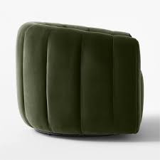 Juniper Green Barrel Swivel Chair with Lumbar Pillow – A luxurious velvet accent chair in rich green, featuring a 360-degree swivel base, high-density foam cushioning, and a supportive lumbar pillow. Its elegant design and durable metal and wood construction make it a stylish and comfortable addition to living rooms, bedrooms, or offices. Ideal for relaxation, with a modern yet classic aesthetic that fits various décor styles.