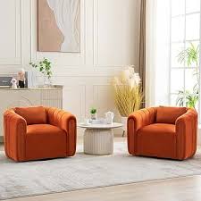 A set of two luxurious barrel swivel chairs in a rich burnt orange velvet upholstery, featuring a sleek, modern design with ergonomic comfort. Each chair is designed with a smooth 360-degree swivel base for easy movement and flexibility. The chairs come with supportive lumbar pillows for extra comfort and proper posture, as well as high-density foam cushioning that contours to your body. The timeless barrel shape, solid wood frame, and metal swivel base ensure durability, while the warm burnt orange hue add