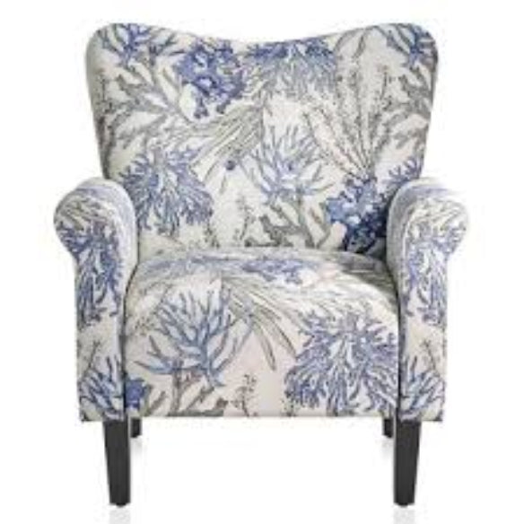 A stylish Blue Coral Accent Chair featuring a vibrant blue coral fabric with a unique pattern. The chair has a tufted wingback design, gracefully tapered wood legs, and padded armrests for optimal comfort. It combines modern sophistication with a classic aesthetic, ideal for any living room, office, or reading nook.