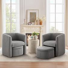 Velvet grey barrel accent chair with hidden ottoman, featuring flared arms, foam-filled seat and back, and matching toss pillows. Space-saving design with storable ottoman underneath. Sturdy solid wood frame with sled base for durability and stability. Ideal for adding style and comfort to any living space.