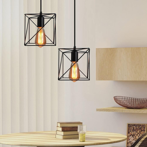 Adjustable black industrial pendant light with geometric metal shade for home decor.