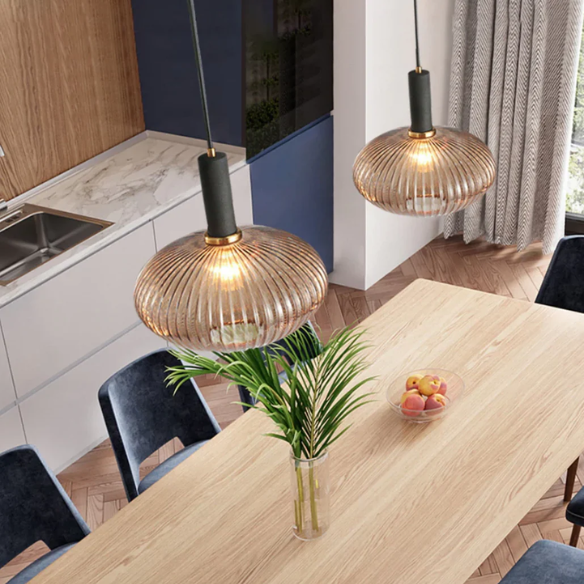 Modern amber pendant light with striped glass shade and black metal body, adjustable height chandelier for dining room, living room, and kitchen.