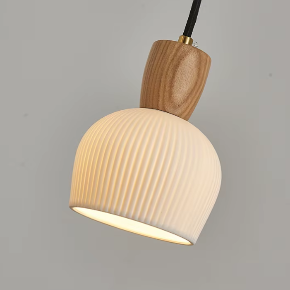 Ash wood pendant light with white ceramic shade for modern kitchen and living room decor.