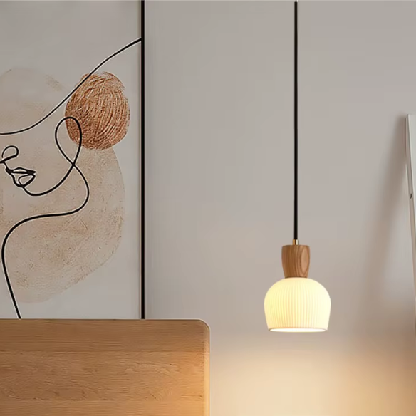 Ash wood pendant light with white ceramic shade for modern kitchen and living room decor.