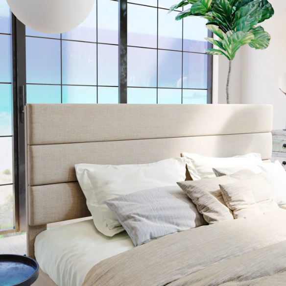 Beige upholstered queen platform bed with tufted headboard and no-box-spring slatted base