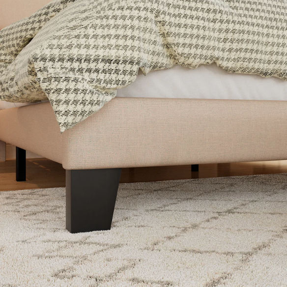 Beige king-size upholstered platform bed with rectangular headboard, linen-blend fabric, and wood slat support