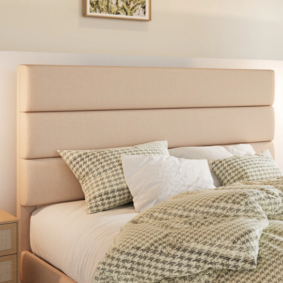Beige king-size upholstered platform bed with rectangular headboard, linen-blend fabric, and wood slat support