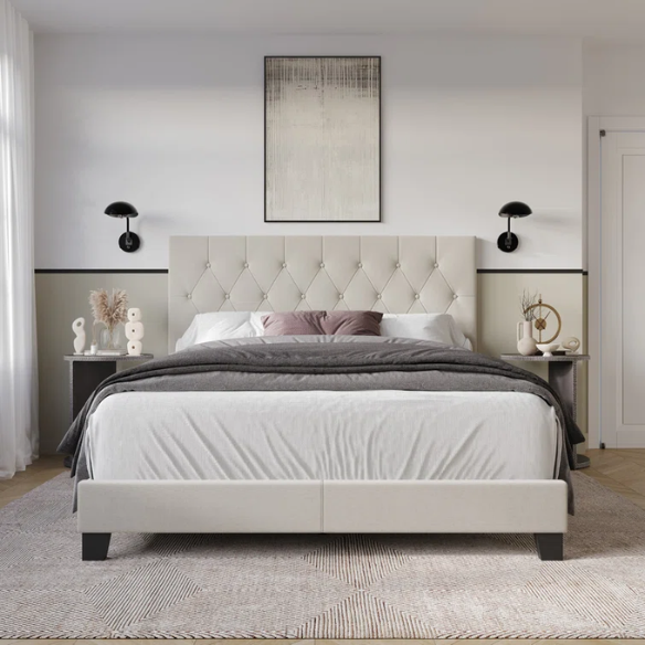 Beige linen full size upholstered bed with button tufted headboard and low-profile legs
