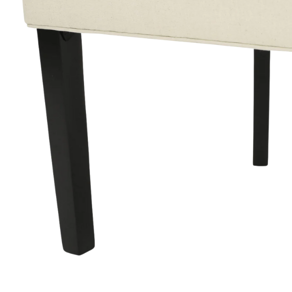 Set of four beige upholstered dining chairs featuring diamond tufting, armless design, sloped sides, and espresso brown wooden legs