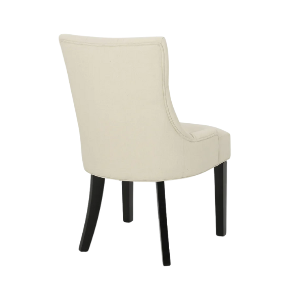 Set of four beige upholstered dining chairs featuring diamond tufting, armless design, sloped sides, and espresso brown wooden legs.