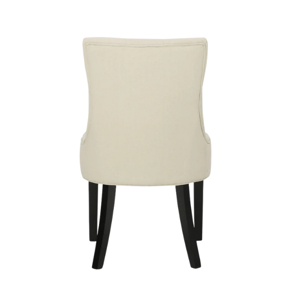 Set of four beige upholstered dining chairs featuring diamond tufting, armless design, sloped sides, and espresso brown wooden legs.