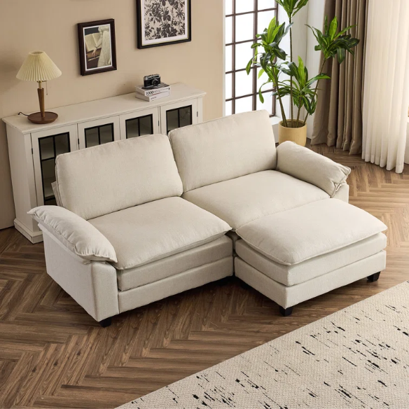 Beige modular cloud sofa with pillow top arms, deep foam cushions, and matching ottoman
