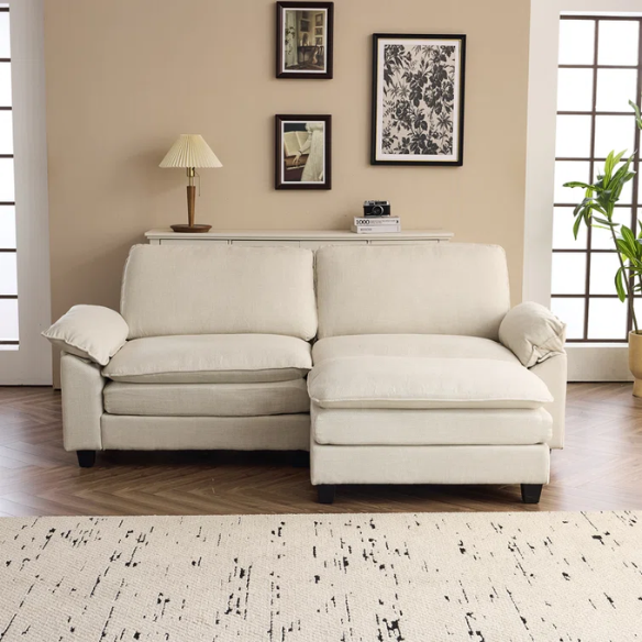 Beige modular cloud sofa with pillow top arms, deep foam cushions, and matching ottoman