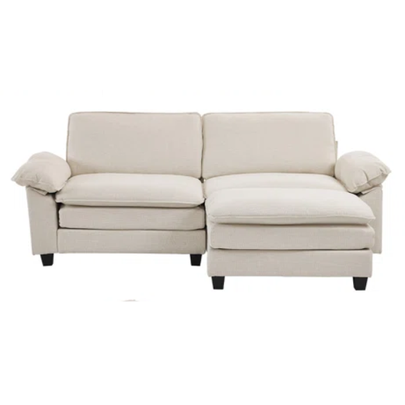 Beige modular cloud sofa with pillow top arms, deep foam cushions, and matching ottoman