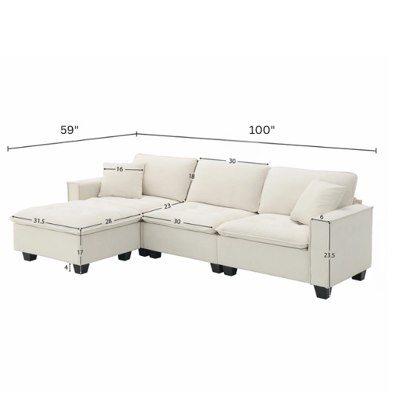 Beige suede L-shaped sectional sofa with removable ottoman, tufted seat cushions, and two matching accent pillows