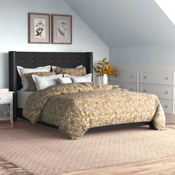 Black faux leather full size bed with button-tufted wingback headboard, nailhead trim, and low-profile frame.