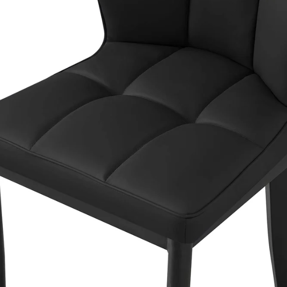 Set of two mid-century modern black faux leather dining chairs with checkered stitching and metal legs