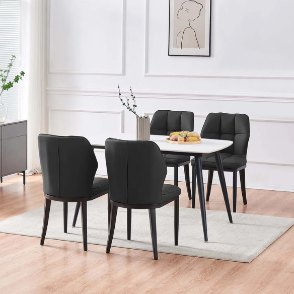 Set of two mid-century modern black faux leather dining chairs with checkered stitching and metal legs