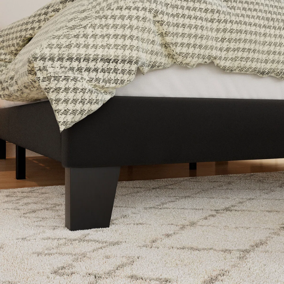 Black king-size upholstered platform bed with rectangular headboard, linen-blend fabric, and no box spring required