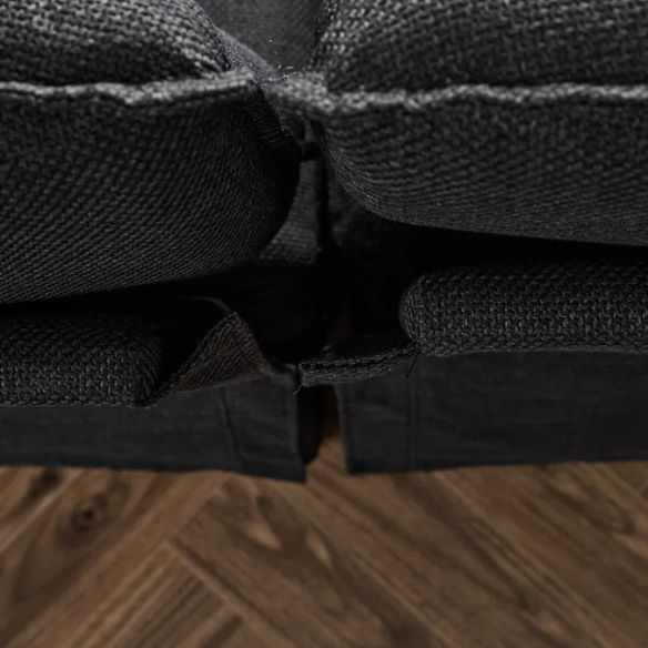 Black modular cloud sofa with deep foam cushions, pillow top arms, and matching ottoman