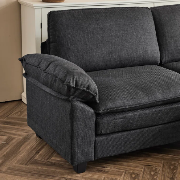 Black modular cloud sofa with deep foam cushions, pillow top arms, and matching ottoman