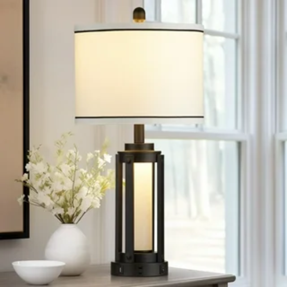 Set of two 25.3-inch modern black table lamps featuring white drum shades with black trim, built-in nightlight, USB and Type-C charging ports, and AC outlet on each base.