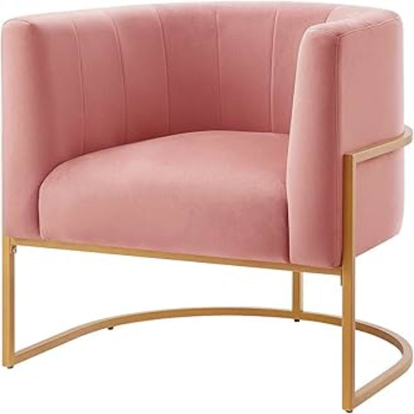 Blush pink velvet barrel accent chair with a U-shaped cantilever gold base, featuring foam-filled seat and back for comfort, and chic channel tufting for added texture. Elegant Art Deco-inspired design with solid wood and stainless steel frame for durability.