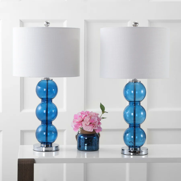 Set of 2 modern table lamps with transparent blue triple-sphere glass base, polished silver accents, and white linen drum shade – elegant lighting for bedroom or living room