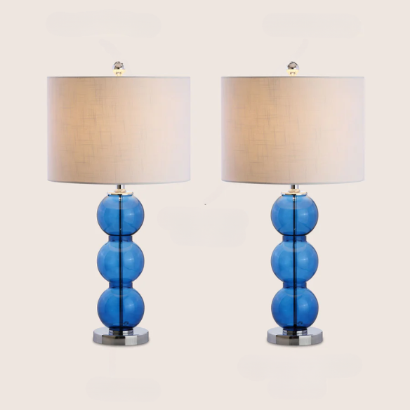 Set of 2 modern table lamps with transparent blue triple-sphere glass base, polished silver accents, and white linen drum shade – elegant lighting for bedroom or living room