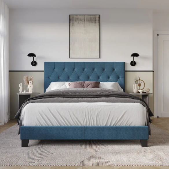 Blue linen full size upholstered bed with button tufted headboard and low-profile legs