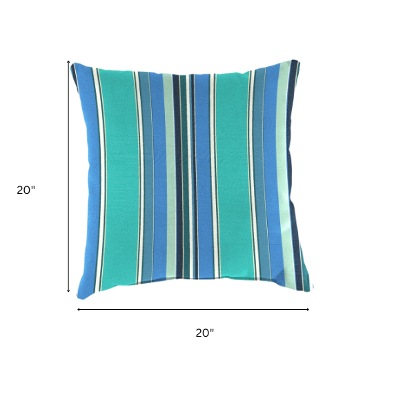 Blue, teal, and white striped accent pillow – reversible, weather-resistant, and overstuffed for comfort; perfect for indoor or outdoor use on patios, decks, or living spaces.