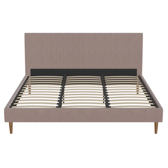 Blush pink velvet upholstered king-size platform bed with padded rectangular headboard, solid wood slats, and elegant low-profile frame.