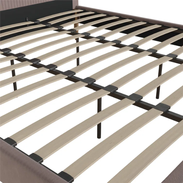 Blush pink velvet upholstered king-size platform bed with padded rectangular headboard, solid wood slats, and elegant low-profile frame.