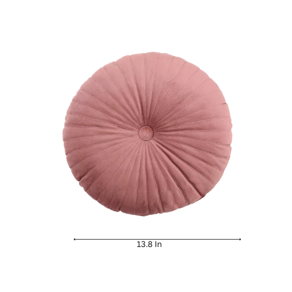 Blush velvet round throw pillow with button closure and pleated design, soft cotton fill for added comfort and support, perfect for home décor and sofa.