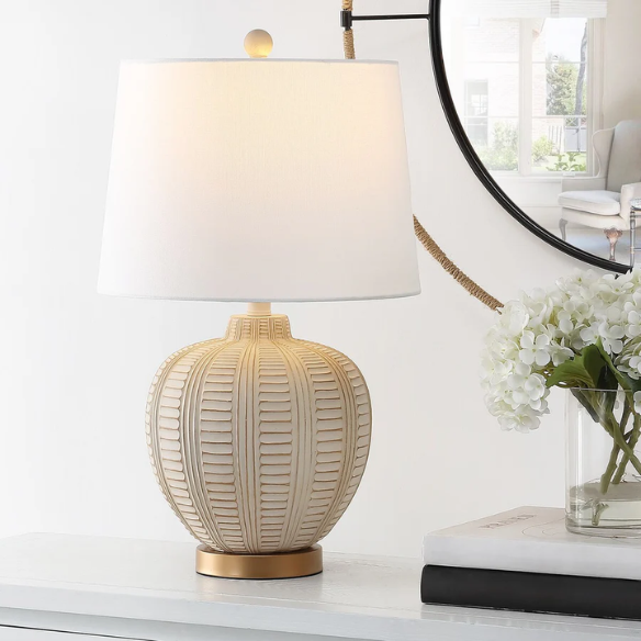 Cream and rose gold resin table lamp with carved textured base, white cotton drum shade, and built-in USB charging port for modern boho interiors